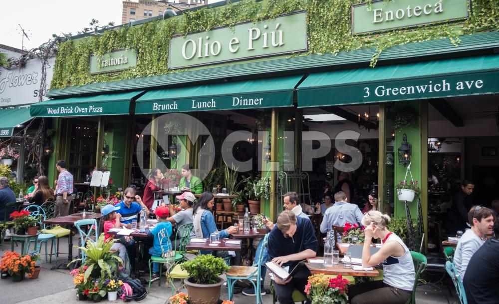 people having Brunch in West Village restaurant on Greenwich Avenue in Manhattan New York City NYC
