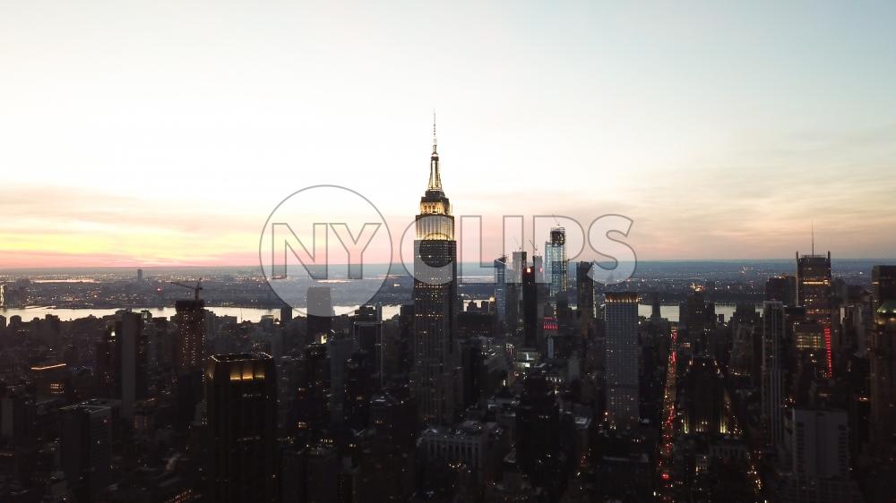 Empire State Building at sunset from high aerial helicopter view in Manhattan New York City NYC