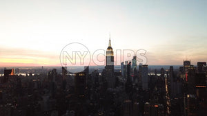 Empire State Building aerial in early evening sunset - Manhattan buildings silhouette in New York City NYC