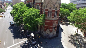 rising aerial of Jefferson Market Library in Greenwich Village - famous clock tower building in Downtown Manhattan