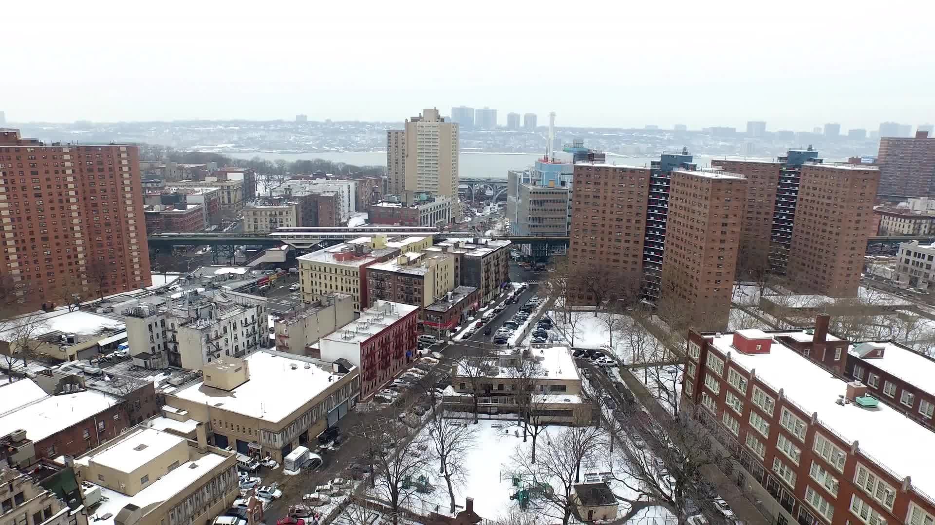Lower East Side housing projects aerial pulling back over red brick buildings 4K NYC