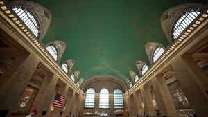 Grand Central Terminal interior with people walking downstairs in summer in New York