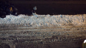 taxi cab driving at night in snow - evening taxicab from overhead view on snowy winter street