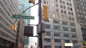 Broadway sign on Christmas - Midtown Manhattan crowded on holidays - woman in Santa Claus costume in street in New York City NYC