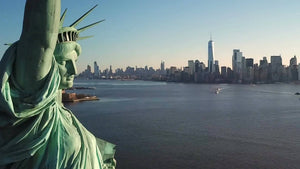 close Statue of Liberty pulling back day time Manhattan skyline New York City NYC 1080 HD