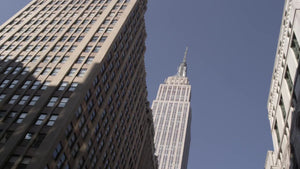 Empire State Building upward view from moving car in Manhattan NYC in 4K and 1080 HD
