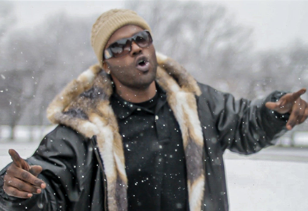 Still from O Da Addic music video during snowstorm