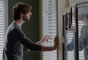 Still of Billy Wilkins and reflection from music video