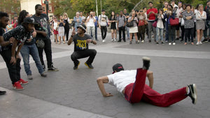 breakdancer performing - dancing in Washington Square Park - breakdancing on summer day