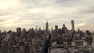 late afternoon aerial moving toward Empire State Building over 5th Ave day in Manhattan New York City NYC