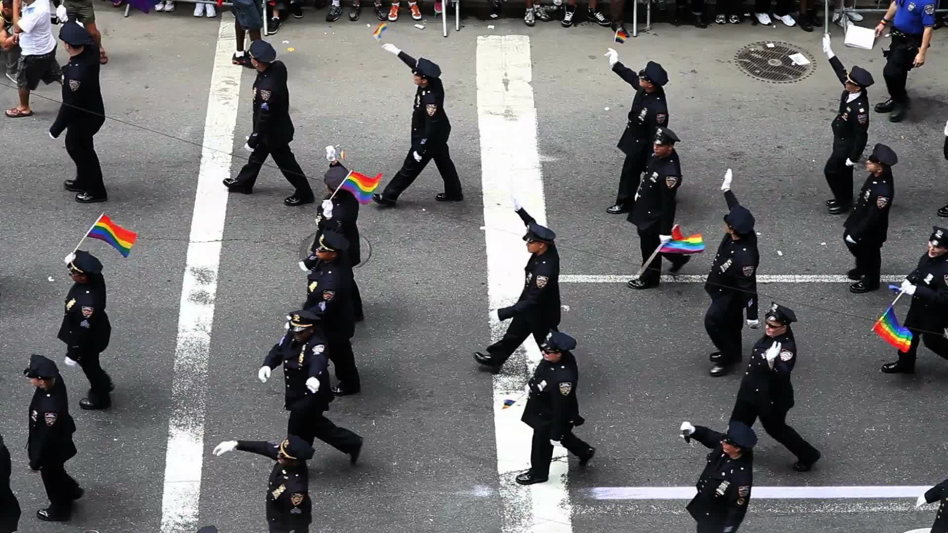 NYPD police officers marching in uniform at Gay Pride Parade in NYC
