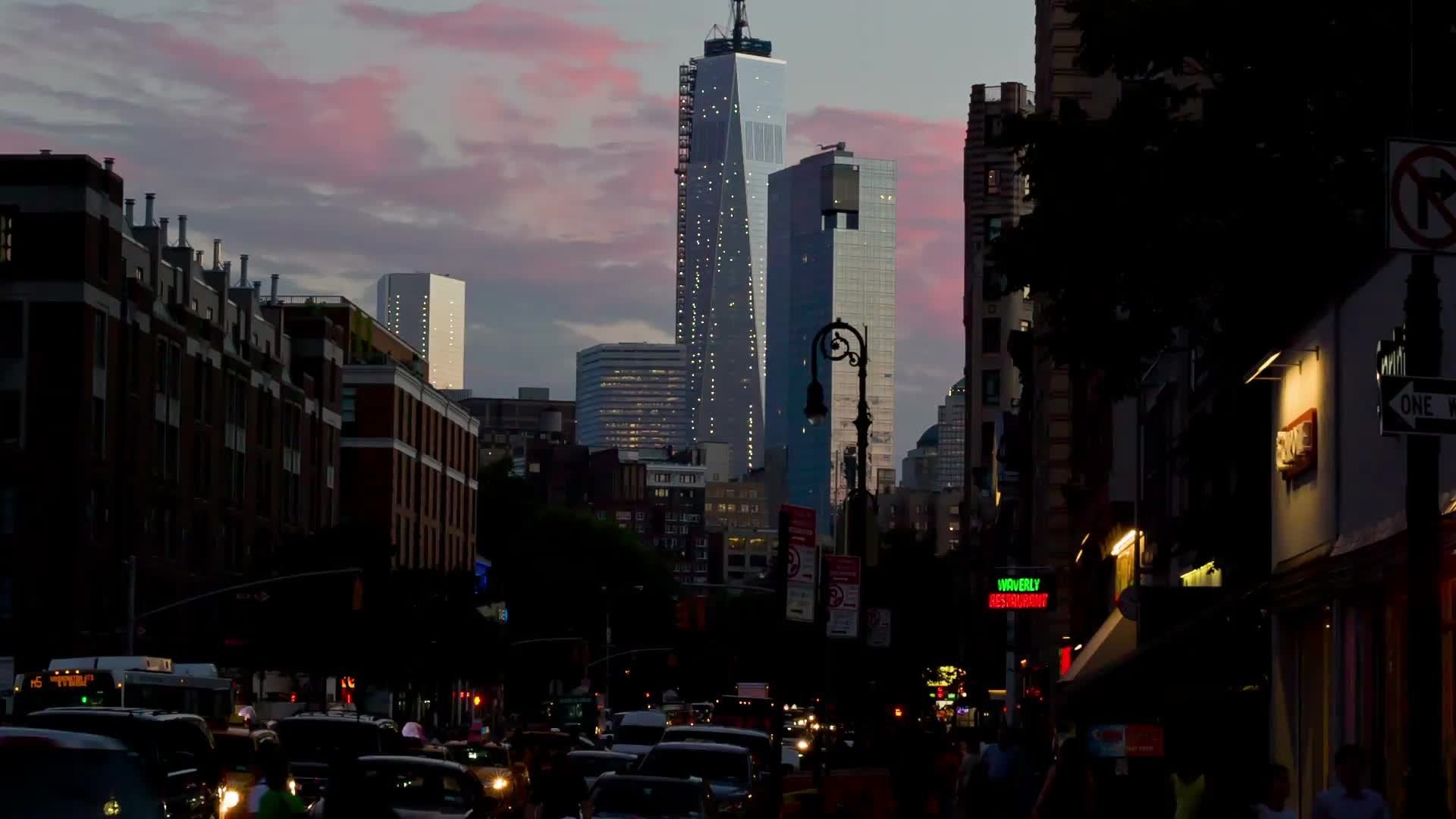 Freedom Tower at dusk early evening 6th Avenue - pink sunset sky Manhattan NYC