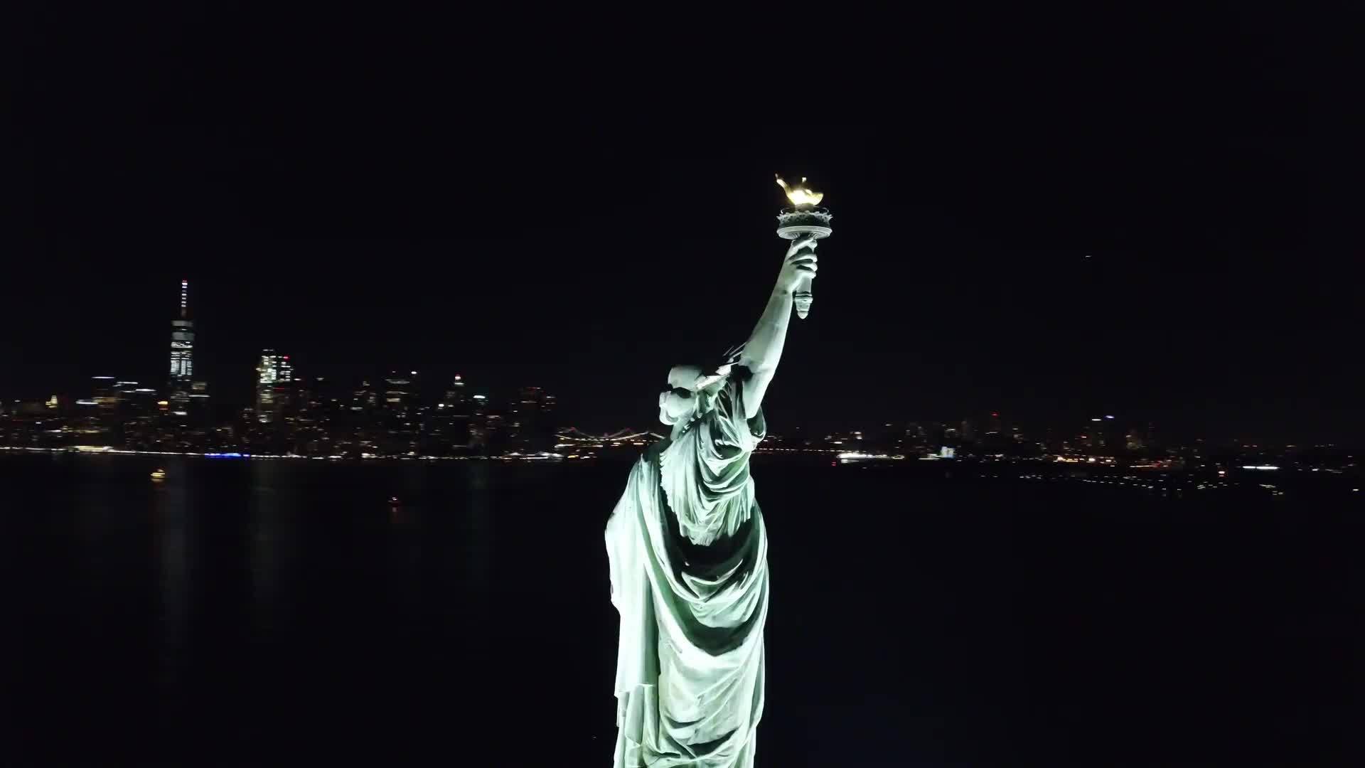 Statue of Liberty aerial from helicopter in New York City NYC circling night 4K and 1080 HD