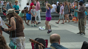 young girl playing Double Dutch in Washington Square Park on summer day in New York City