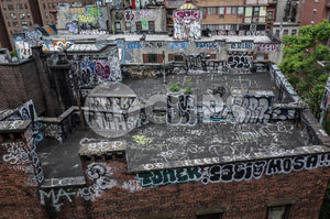 graffiti all over building rooftop - roof with spray paint vandalism art in Brooklyn