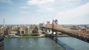 Queensboro Bridge - timelapse - cars driving in fast motion over East River during day