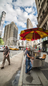 hot dog stand in Flatiron District on 5th Ave - summer day in Manhattan NYC