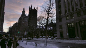 women walking down street on winter evening at sunset - First Presbyterian Church - snow on ground on 5th Avenue