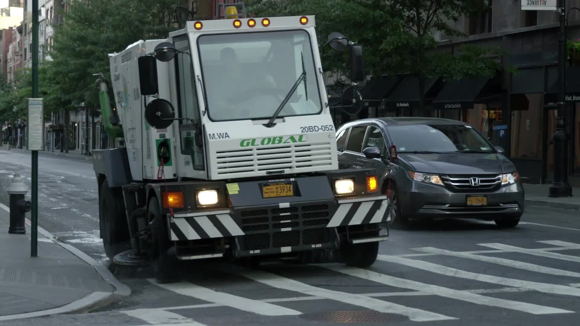 street sweeper cleaning street early in morning in Manhattan