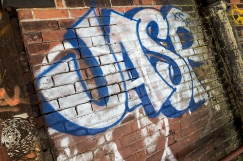 Graffiti piece on brick wall in Brooklyn