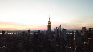 Empire State Building aerial in early evening sunset - Manhattan buildings silhouette in New York City NYC