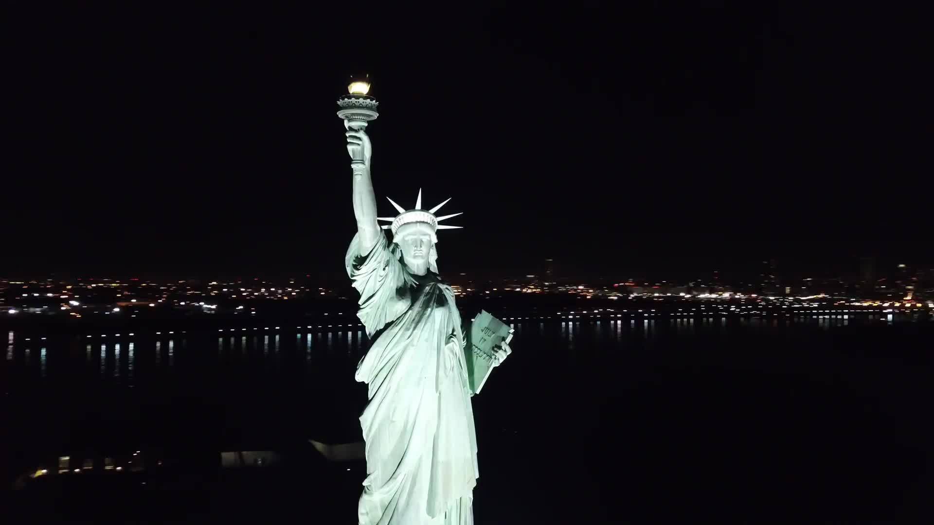 Statue of Liberty aerial circling night 4K and 1080 H