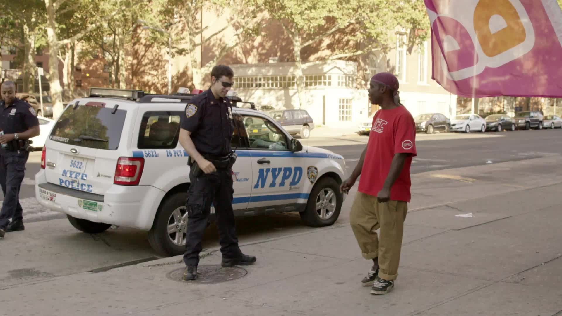 NYPD police officer doesn't want to shake man's hand, in this awkward moment of either germaphobia or racism. Summer day in NYC.