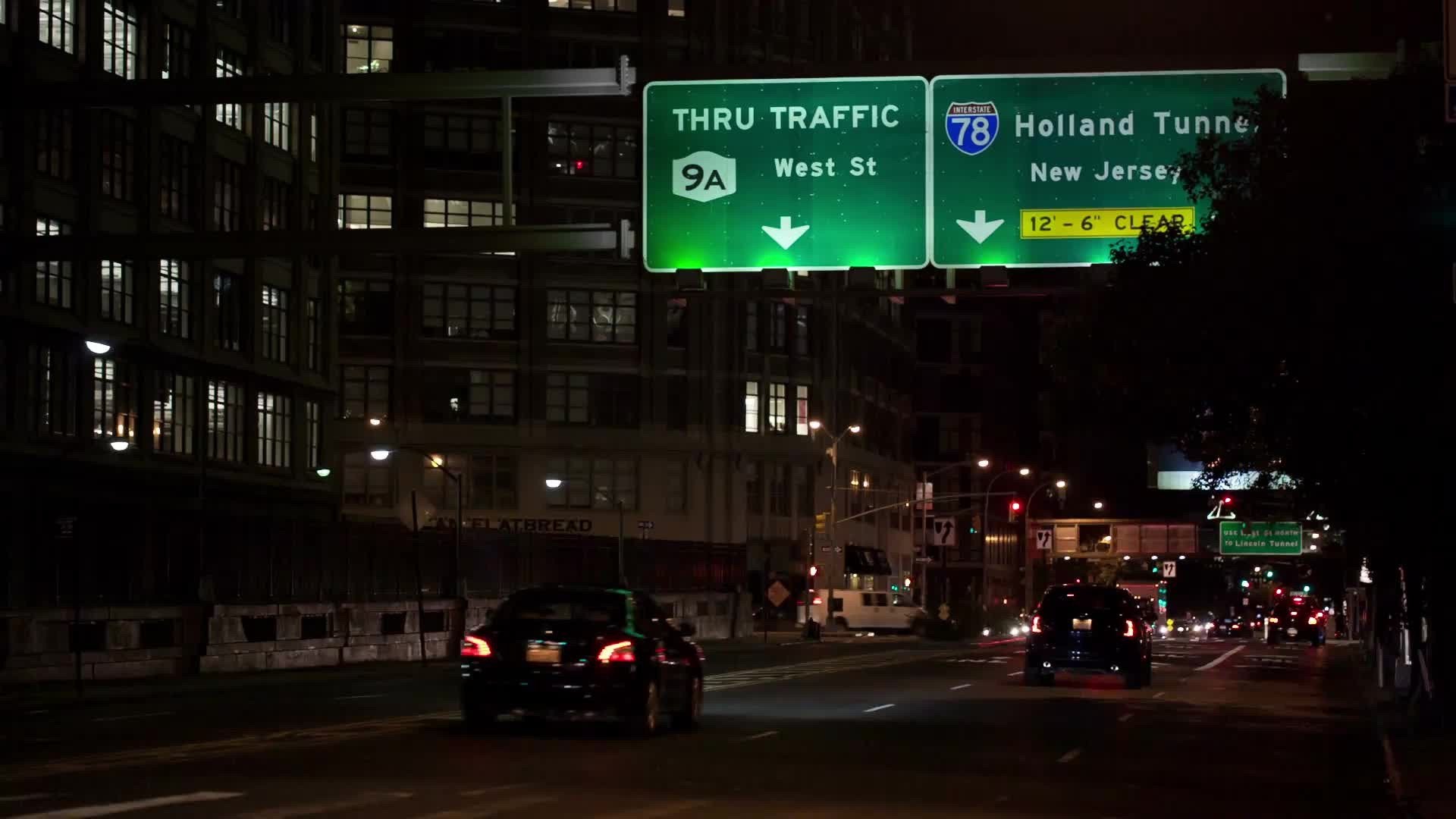 sign for Holland Tunnel on Varick Street in Lower Manhattan at night in NYC