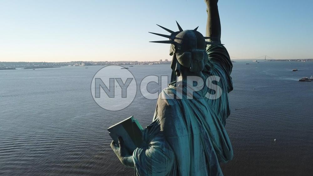 Statue of Liberty rear view looking out onto sea in New York City