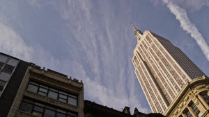 Empire State Building from moving car street view upward angle on beautiful day in 4K and 1080 HD NYC