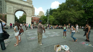 trans woman playing Double-Dutch in Washington Square Park on summer day in NYC