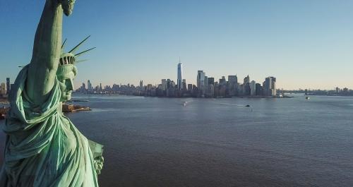 Statue of Liberty closeup with Manhattan skyline in background in New York City NYC