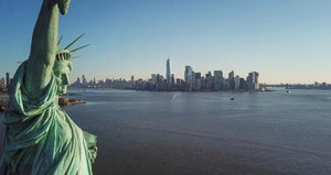 Statue of Liberty closeup with Manhattan skyline in background in New York City NYC