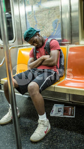 student sleeping on subway train in summer - kid asleep in NYC