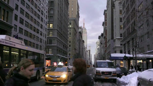 people crossing 5th ave in early evening winter day, Empire State Building and taxi in background, 1080 HD in NYC