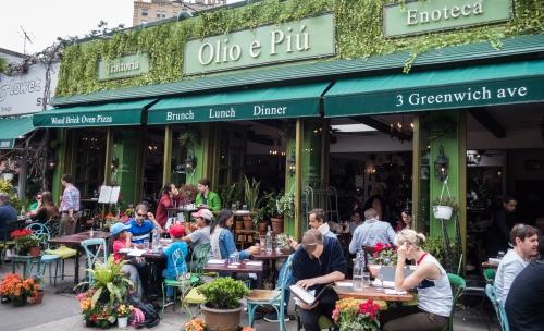 people having Brunch in West Village restaurant on Greenwich Avenue in Manhattan New York City NYC